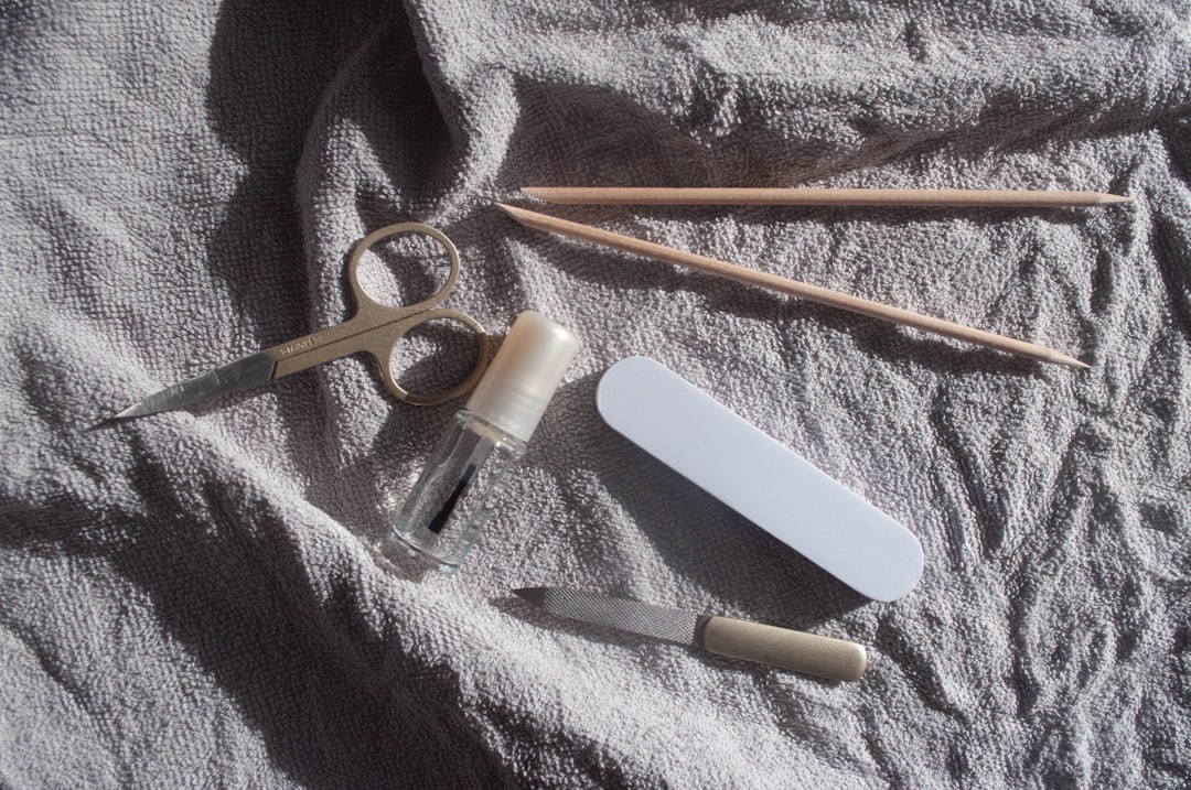 Manicure tools laid out on a white towel.